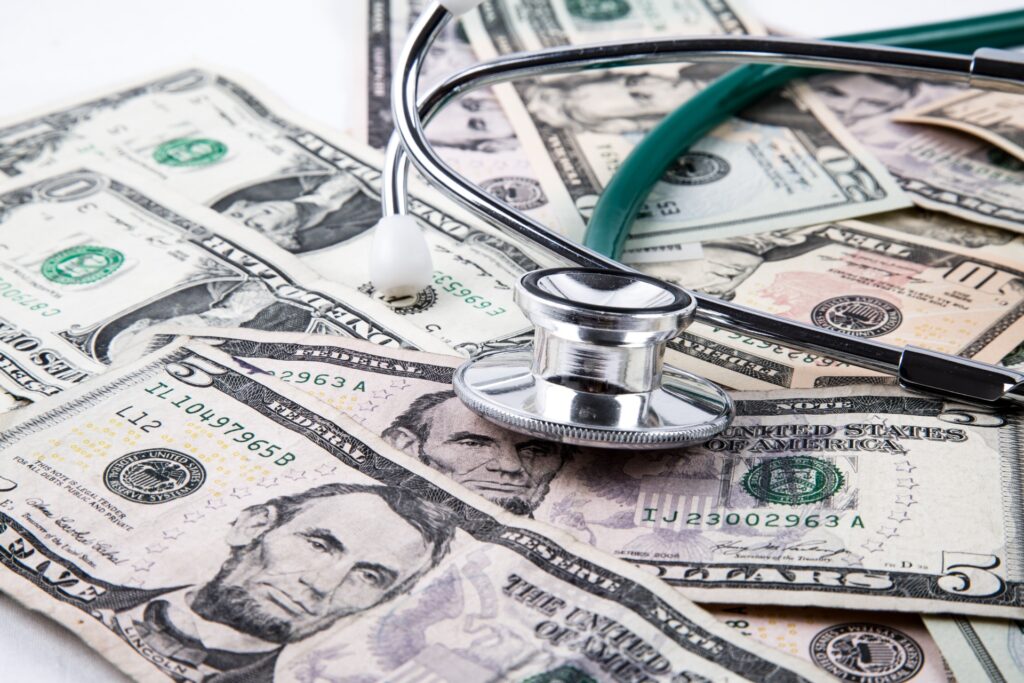 Stethoscope Laying On Pile Of Money