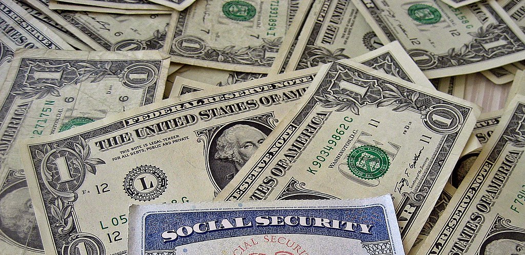 Social Security Card On Pile Of Cash