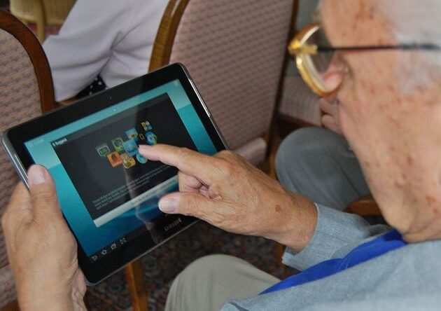 Elderly Man Using Tablet